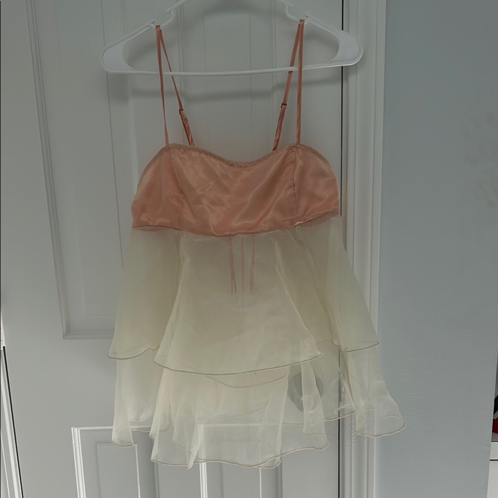 Diaphanous Ballet pink and off white. Adjustable straps and tie back. Never worn